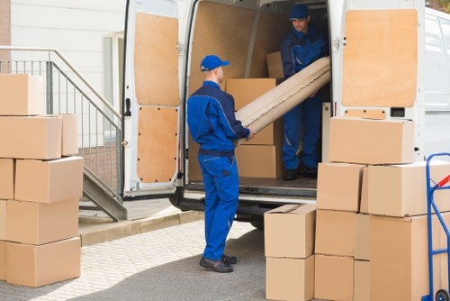 Van unloading household items at a Pimlico home