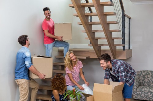Removal team planning a home move in Pimlico with packed boxes and furniture