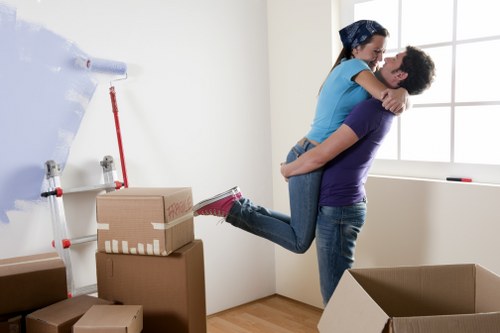 Same day removals crew carrying household items in central London