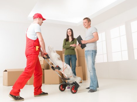 Removal team navigating a Pimlico street with moving van